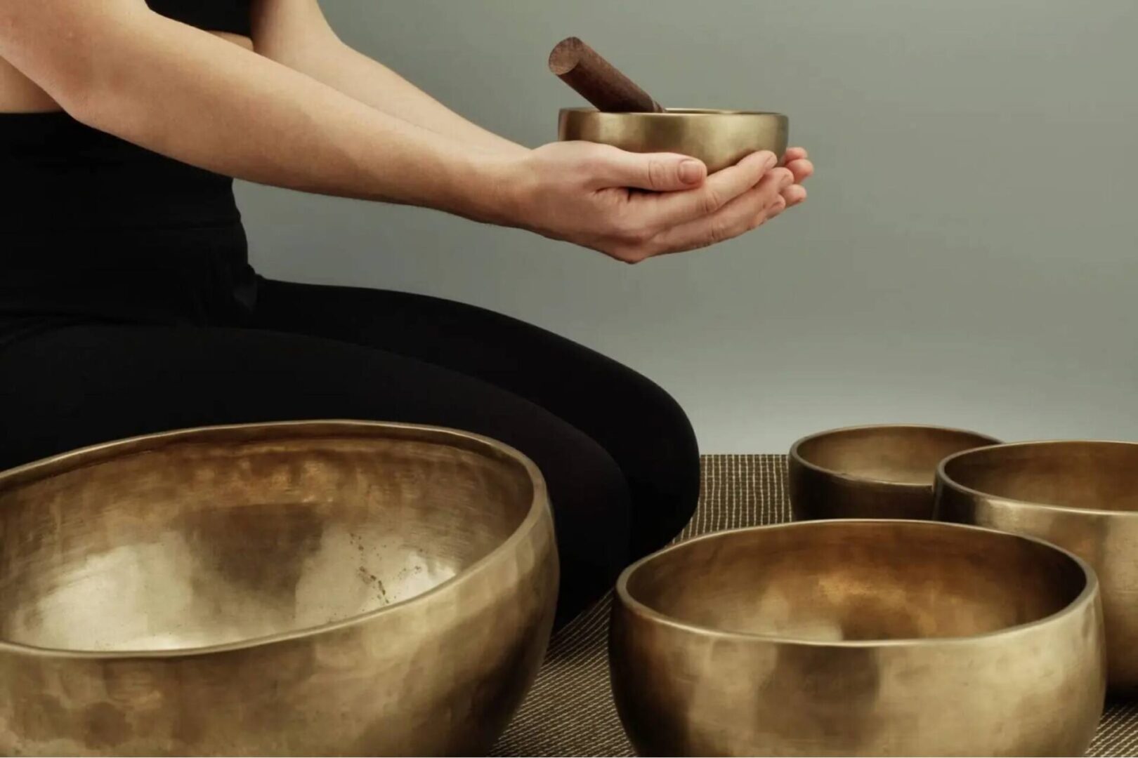 A person is holding some bowls in their hands